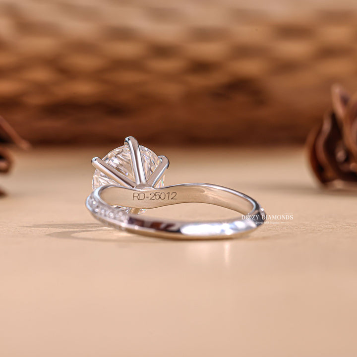 Round pave lab grown diamond ring fitted on finger