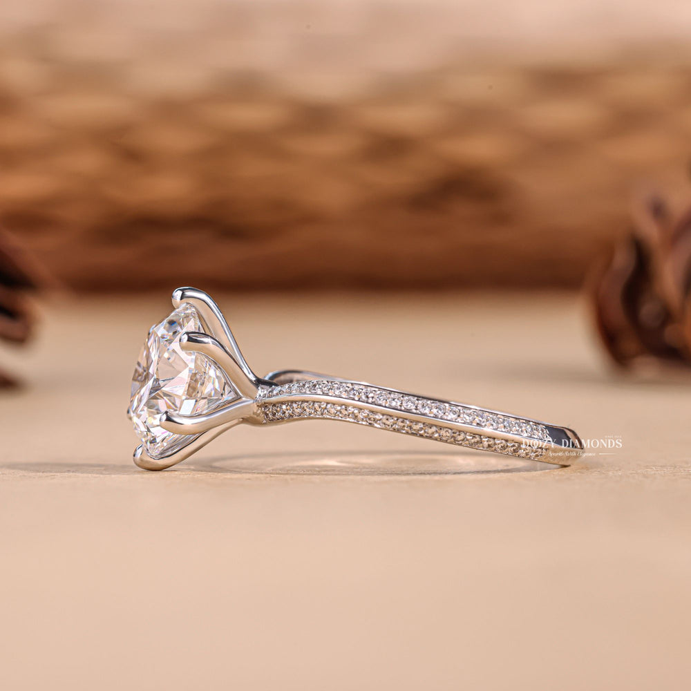 Round cut diamond ring worn on hand