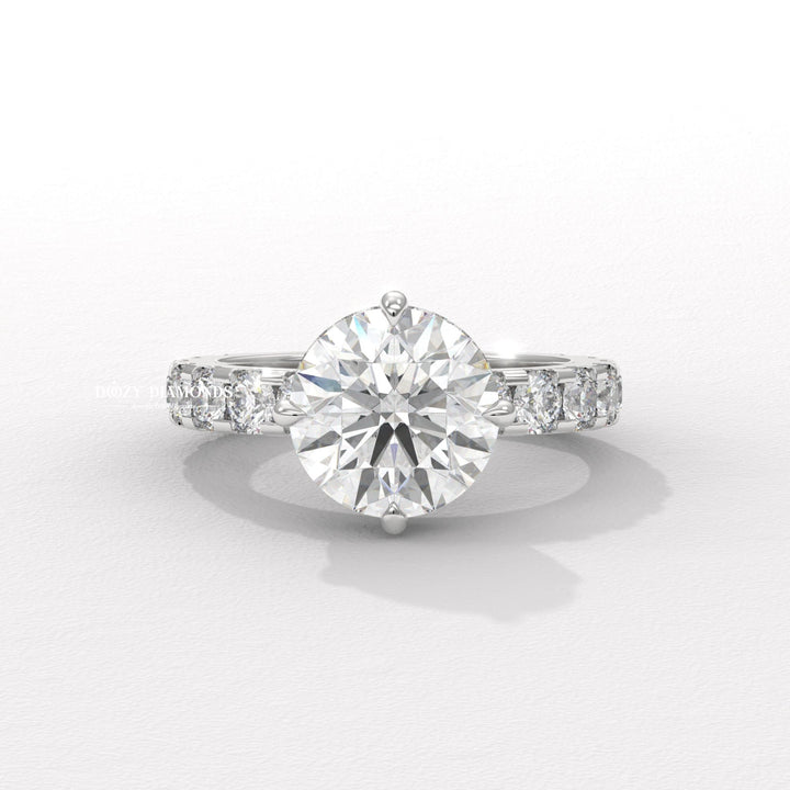 Round hidden halo engagement ring shown on hand for true-to-life sizing