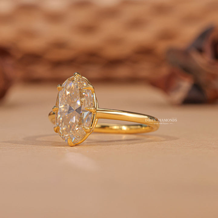 Lifestyle shot of oval solitaire diamond ring on hand