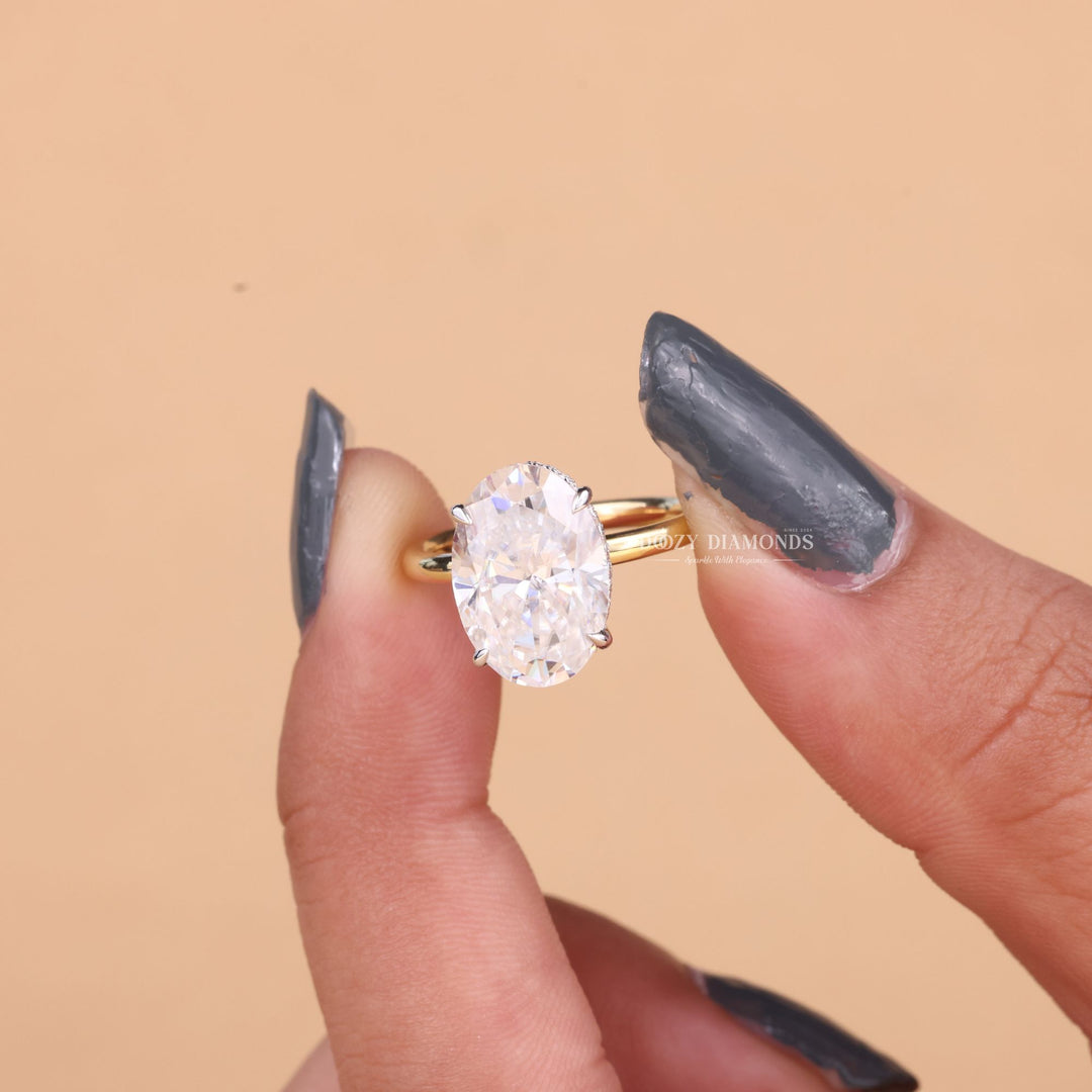 Detailed close-up of oval hidden halo diamond engagement ring