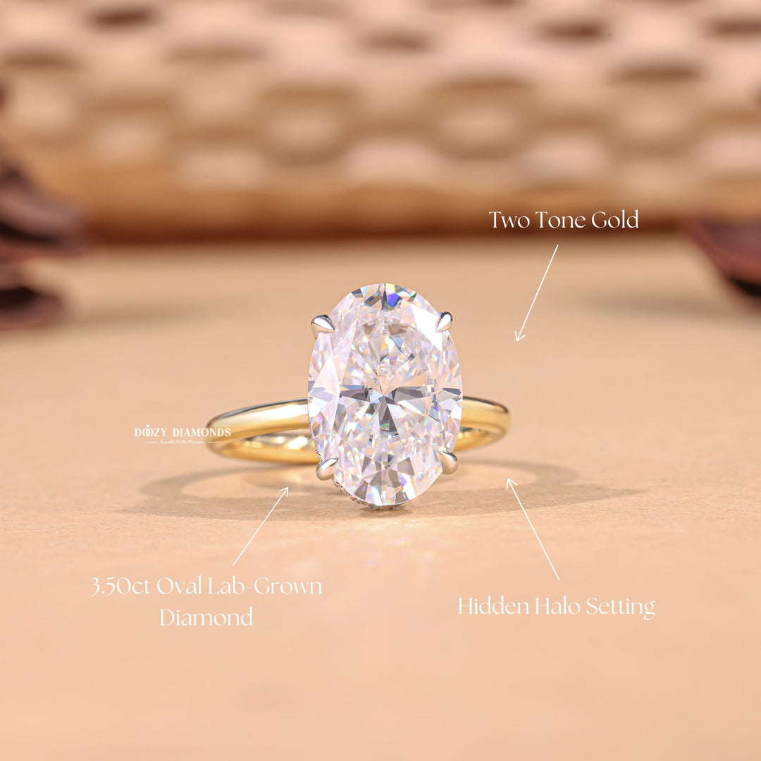 Oval hidden halo engagement ring viewed from the side