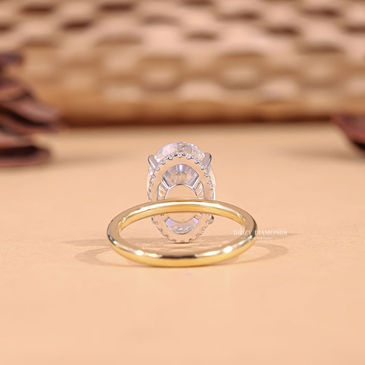 Side angle of oval hidden halo diamond engagement ring