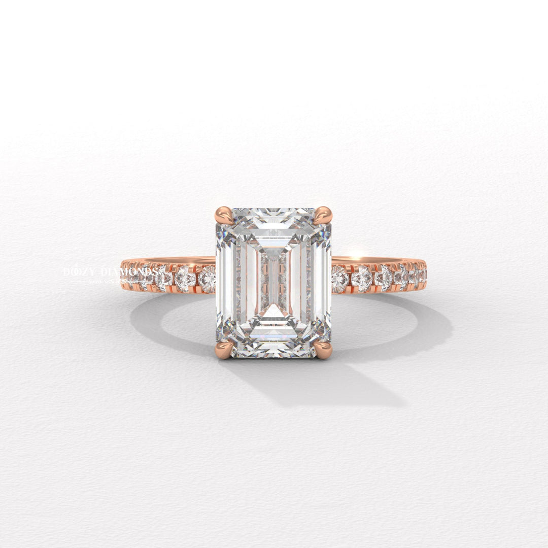 Certified emerald cut diamond featured in pave engagement ring