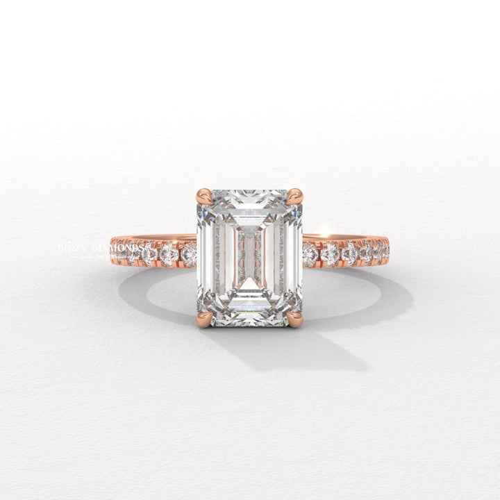 Certified emerald cut diamond featured in pave engagement ring