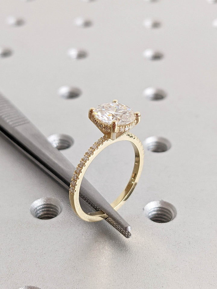 Macro shot of round cut diamond facets in hidden halo ring setting