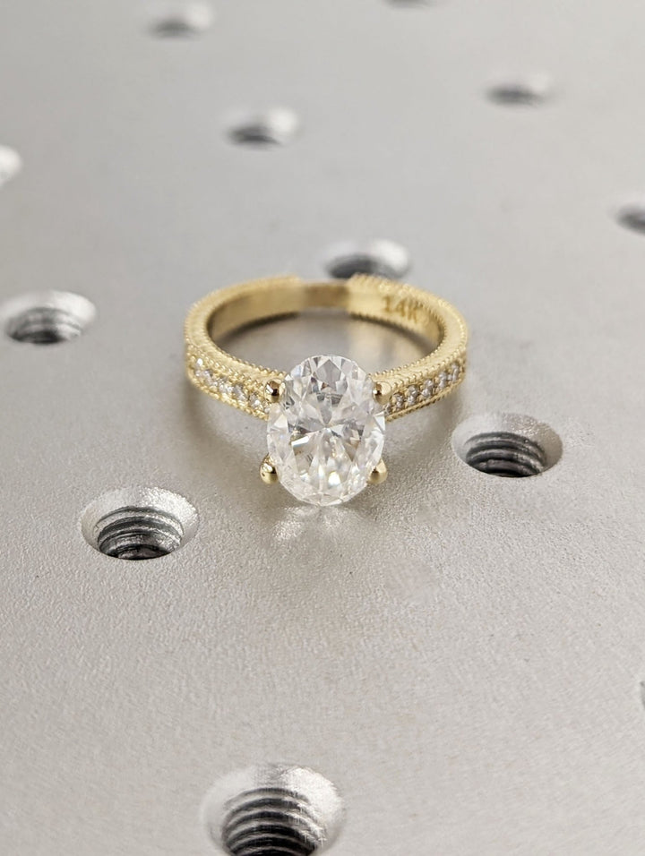Lifestyle shot of oval vintage diamond ring on hand