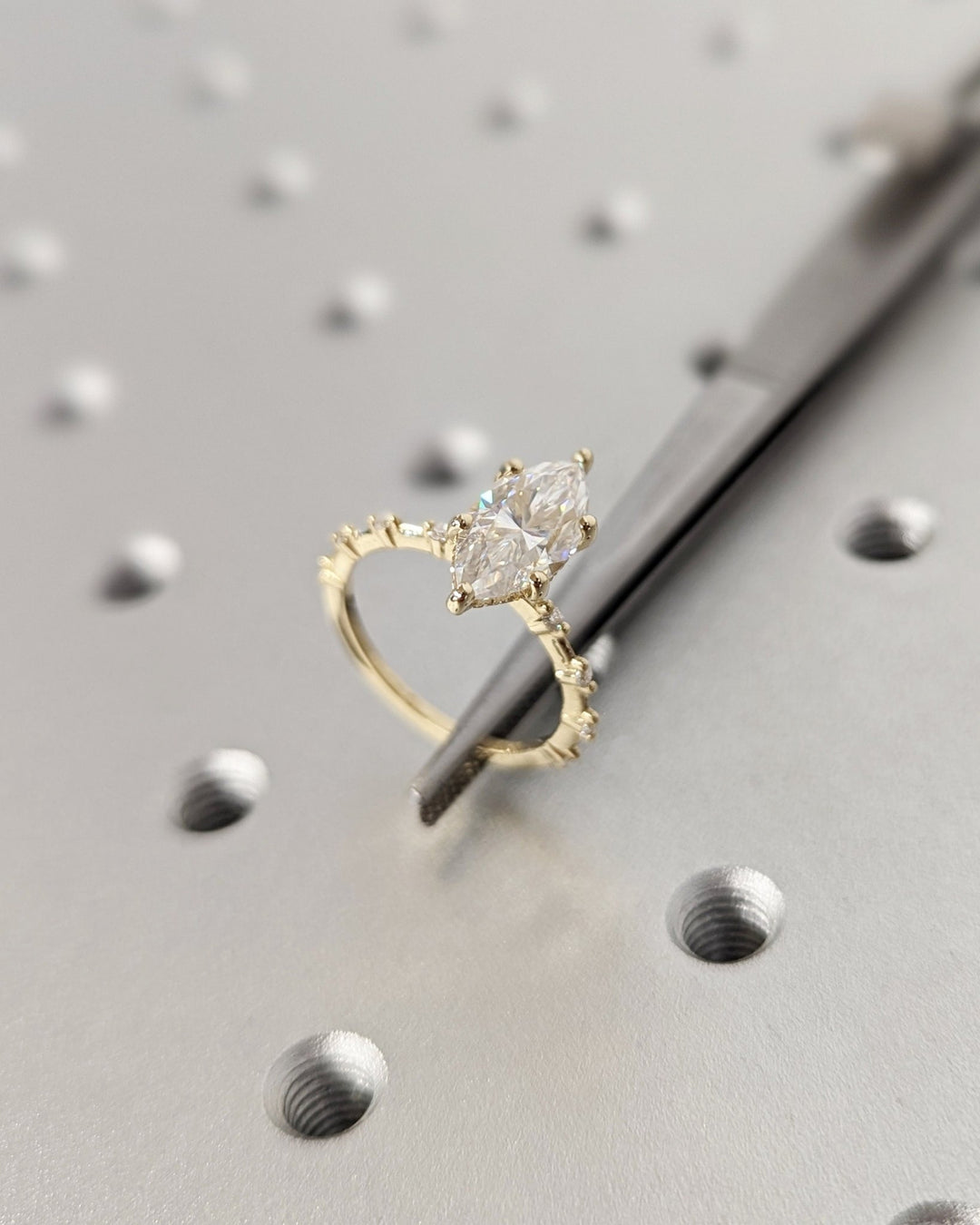 Marquise hidden halo engagement ring finished in polished solid gold