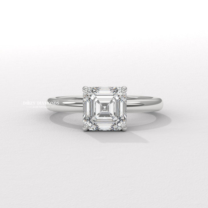 Close-up of asscher cut center diamond in solitaire engagement ring