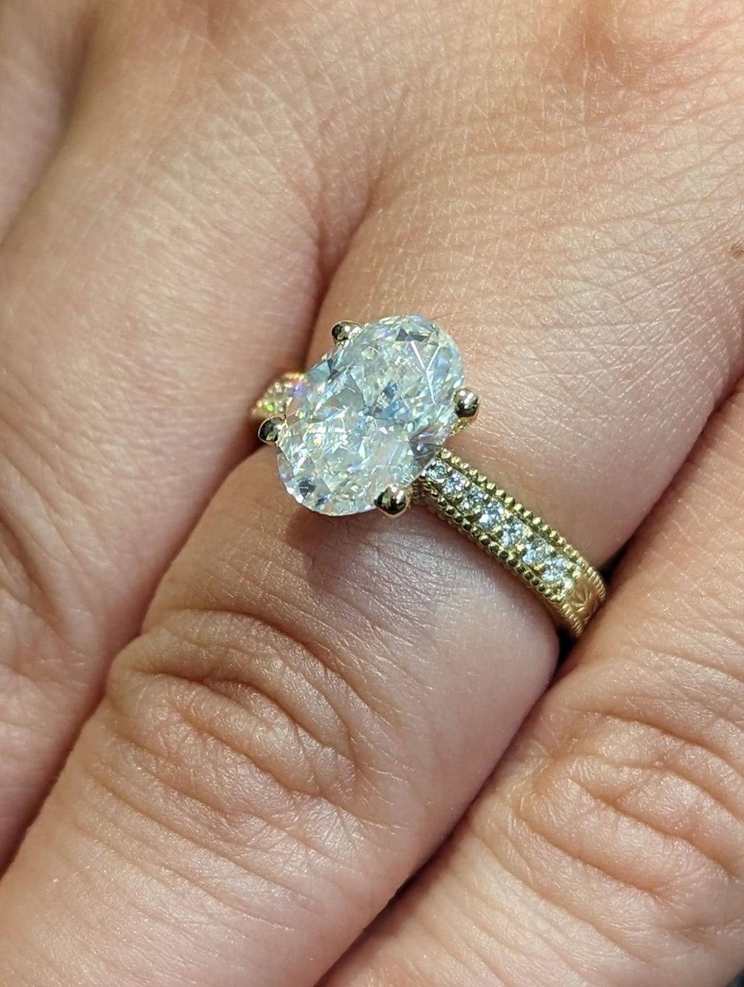 Oval cut vintage engagement ring with IGI certified center diamond