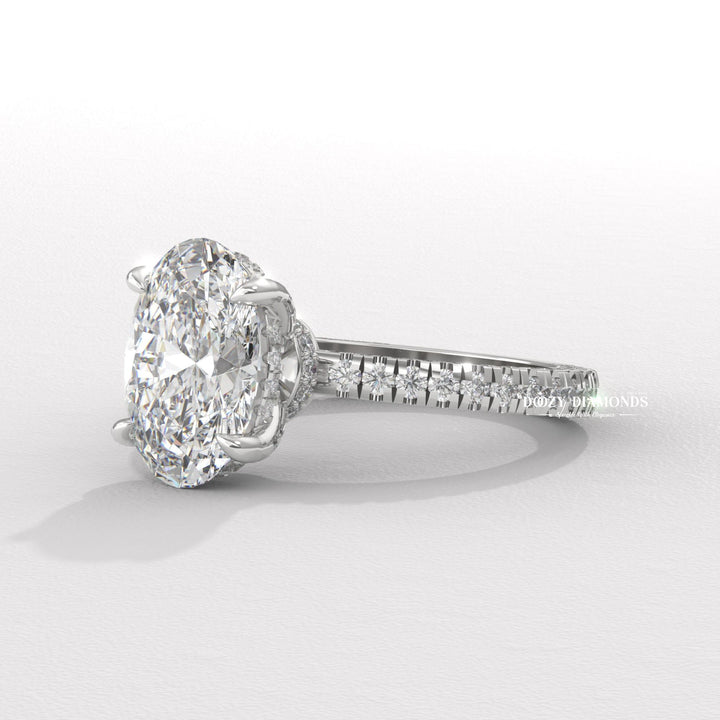 Profile view of oval cut pave engagement ring band
