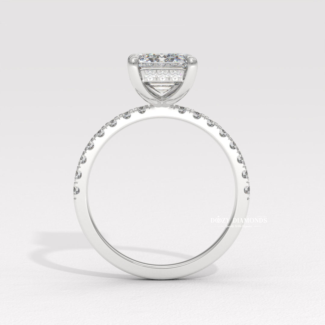 Side angle of emerald hidden halo diamond engagement ring