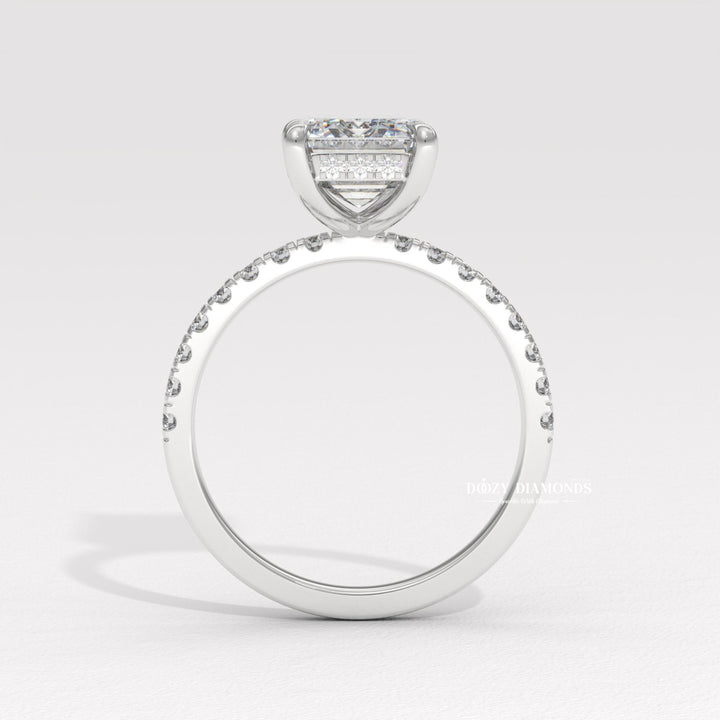 Side angle of emerald hidden halo diamond engagement ring