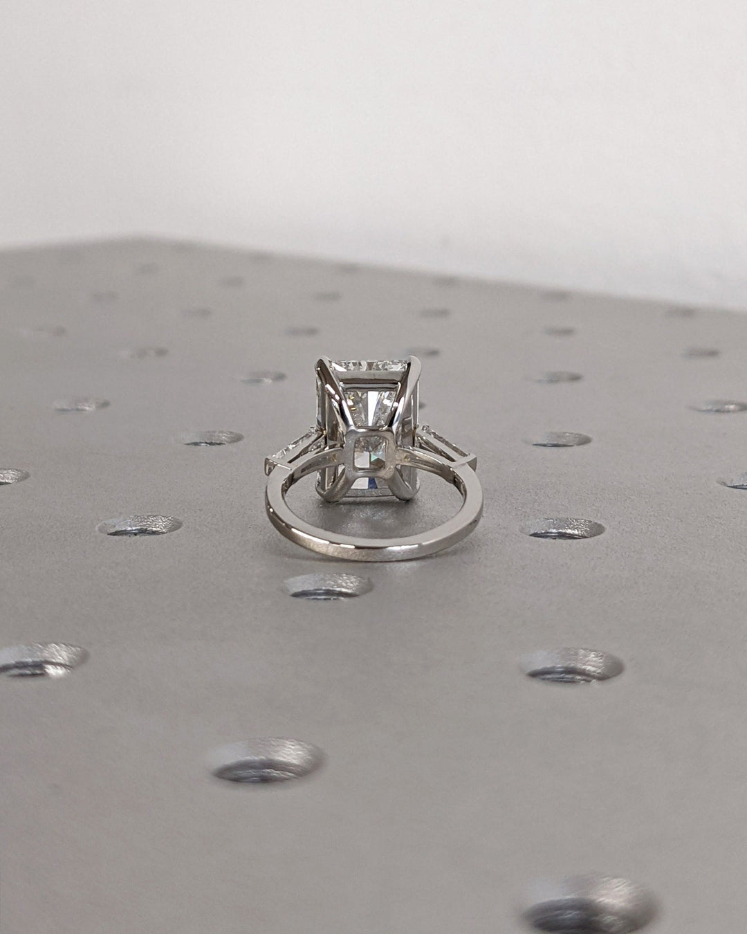 Radiant three stone lab grown diamond ring side profile in gold setting
