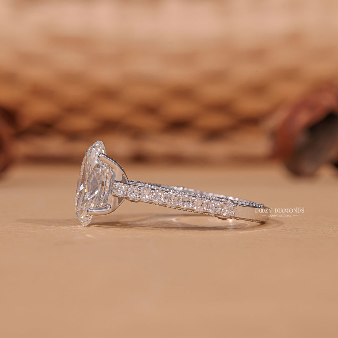 Oval cut engagement ring shown with authenticity certificate