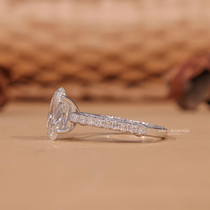 Oval cut engagement ring shown with authenticity certificate
