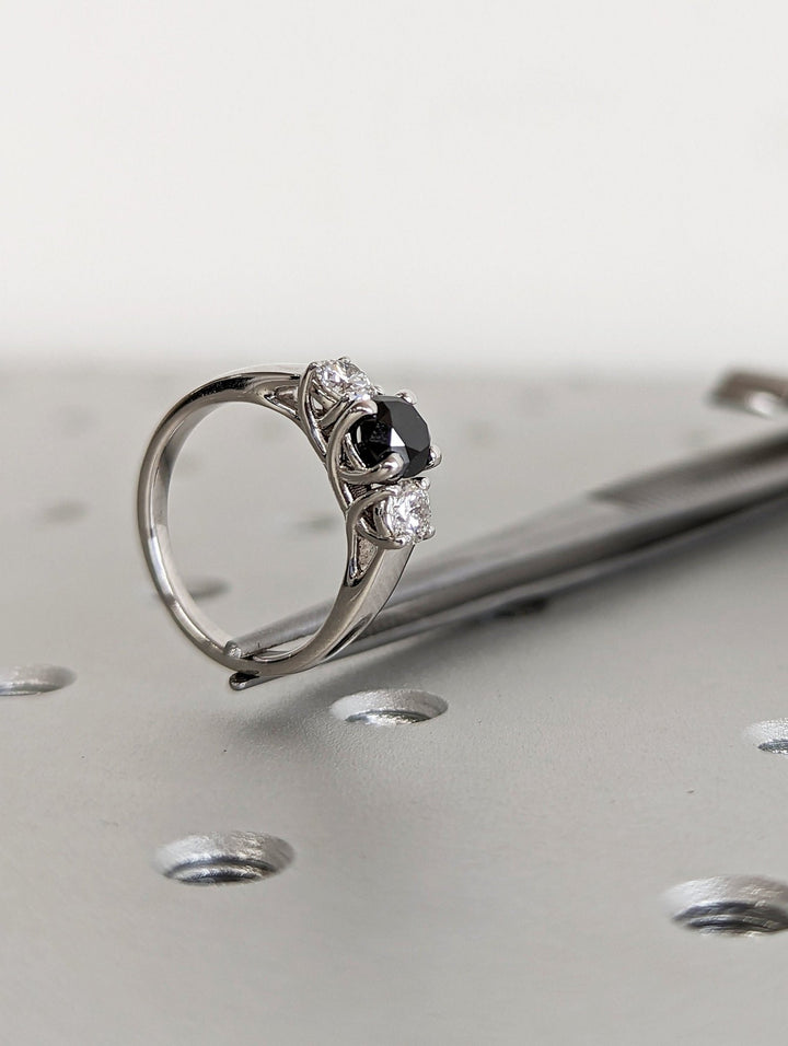 Round cut solitaire engagement ring shown in real-life wear