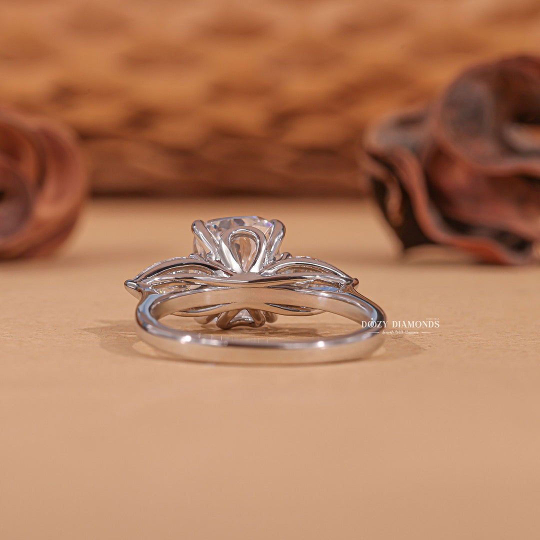 Cushion three stone ring set with an IGI graded diamond