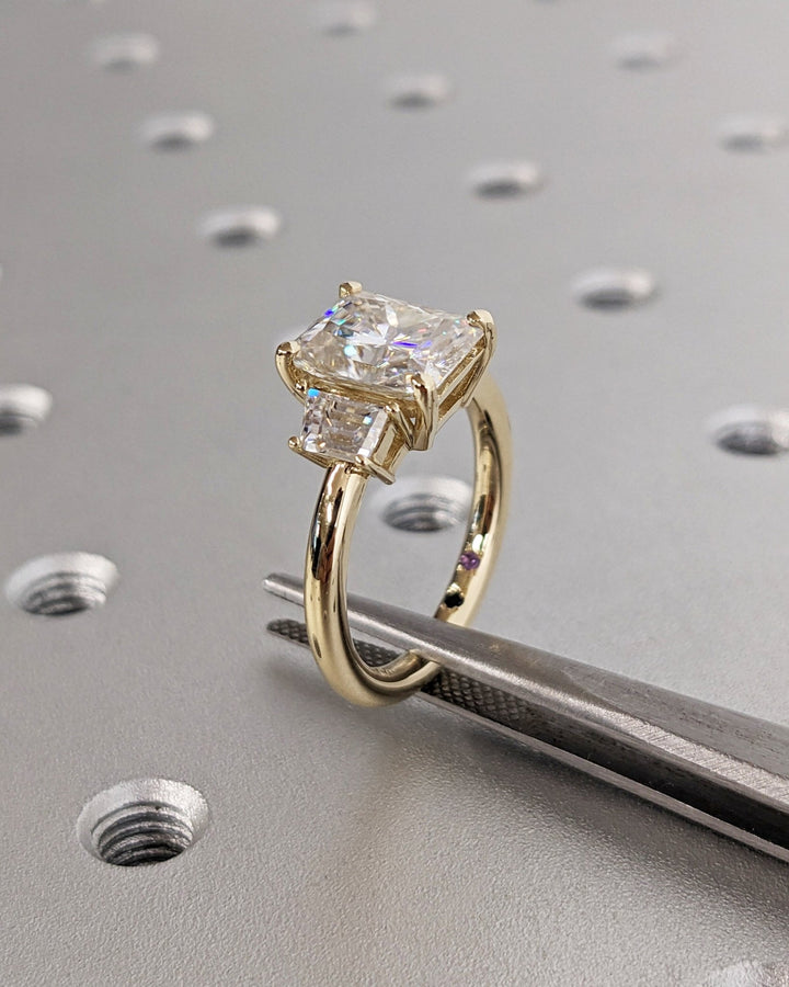 Radiant cut solitaire engagement ring shown in real-life wear