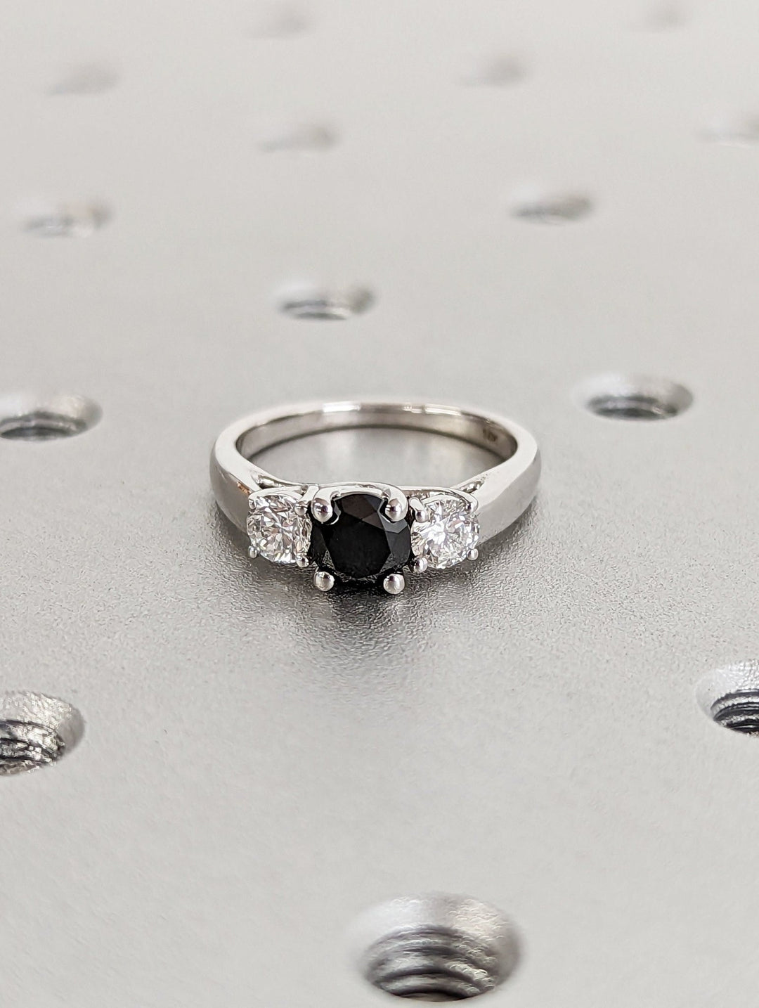 Side angle of round solitaire diamond engagement ring