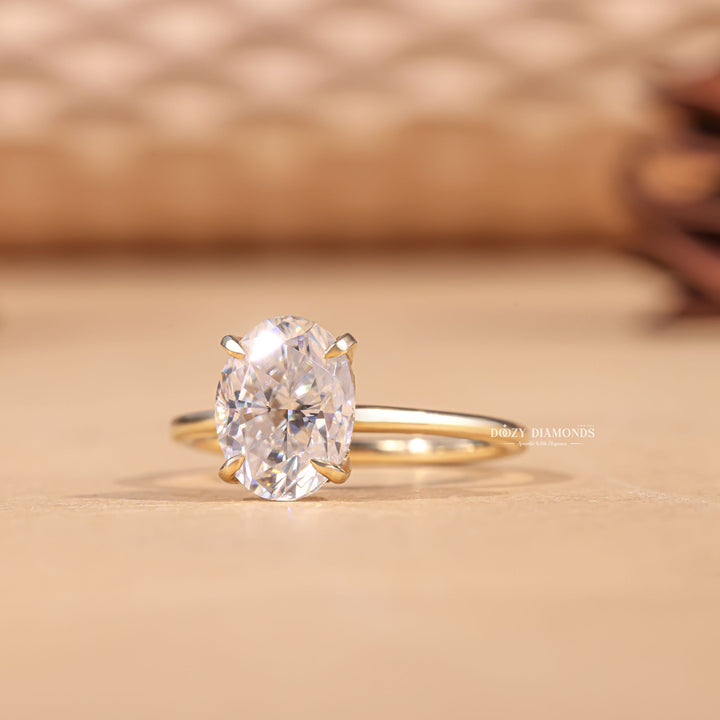 Classic oval hidden halo engagement ring crafted for everyday wear