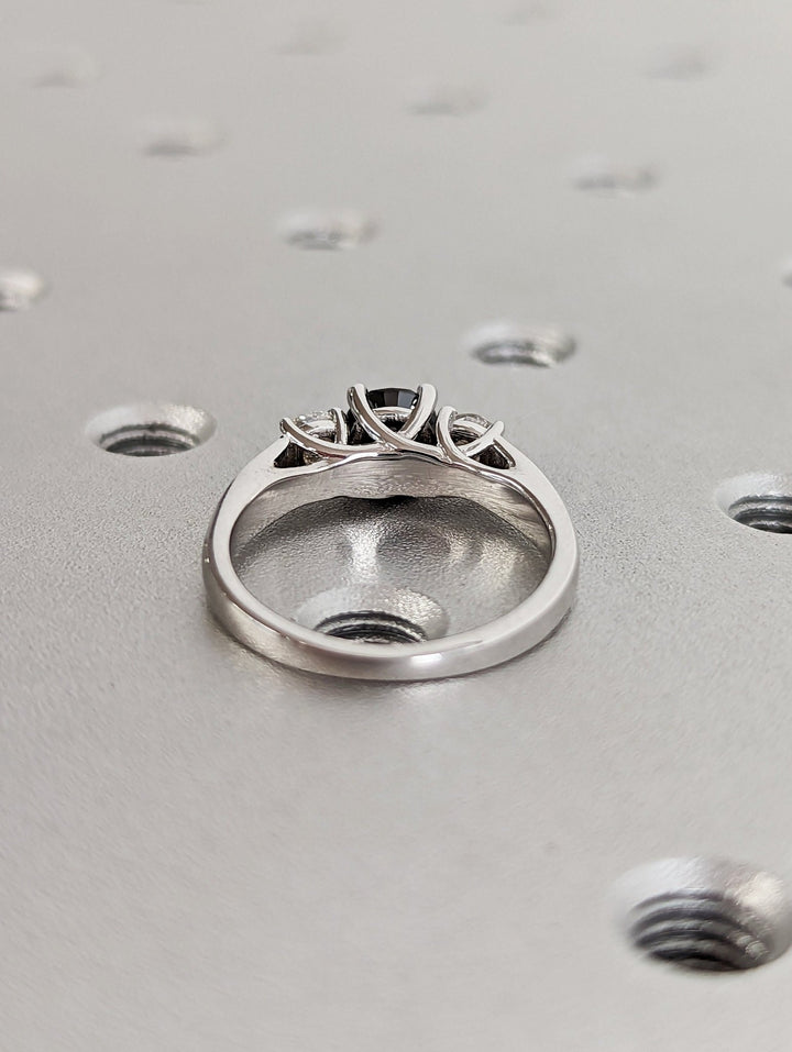 Round solitaire engagement ring shown on hand for true-to-life sizing
