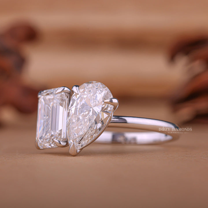 Pear solitaire engagement ring shown on hand for true-to-life sizing