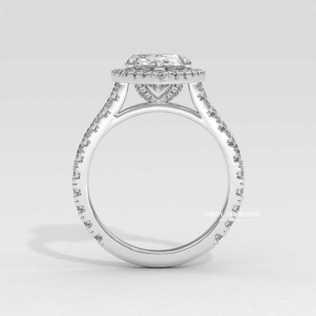 Pear halo diamond ring presented in signature gift packaging