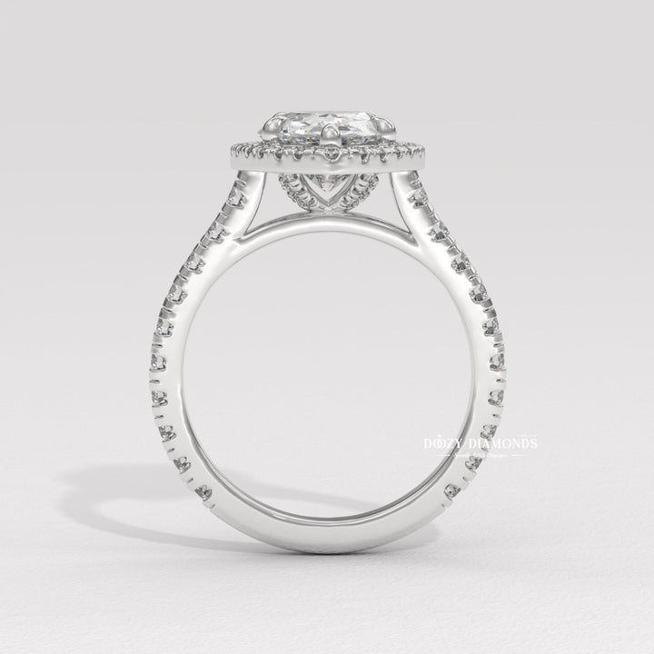 Pear halo diamond ring presented in signature gift packaging