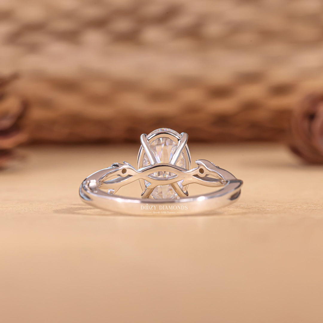 Angled view of oval cut diamond in solitaire setting