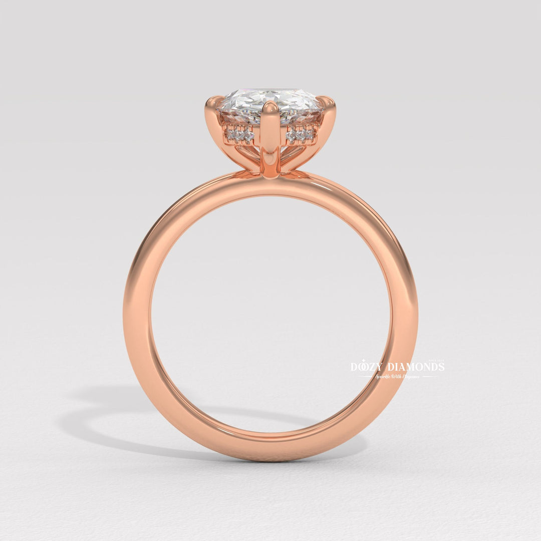Unboxing view of pear cut hidden halo diamond engagement ring