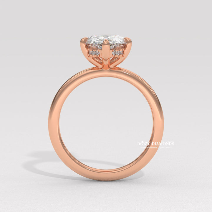 Unboxing view of pear cut hidden halo diamond engagement ring