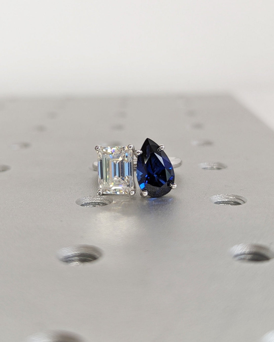 Emerald solitaire diamond ring presented in signature gift packaging