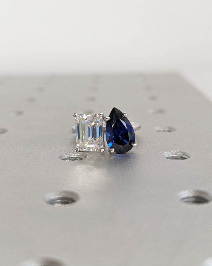 Emerald solitaire diamond ring presented in signature gift packaging