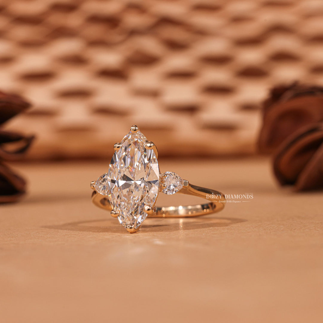 Detailed close-up of marquise three stone diamond engagement ring