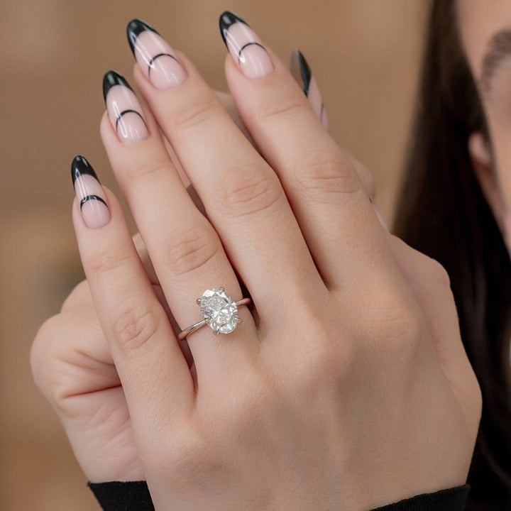 Top-down view of oval cut hidden halo engagement ring
