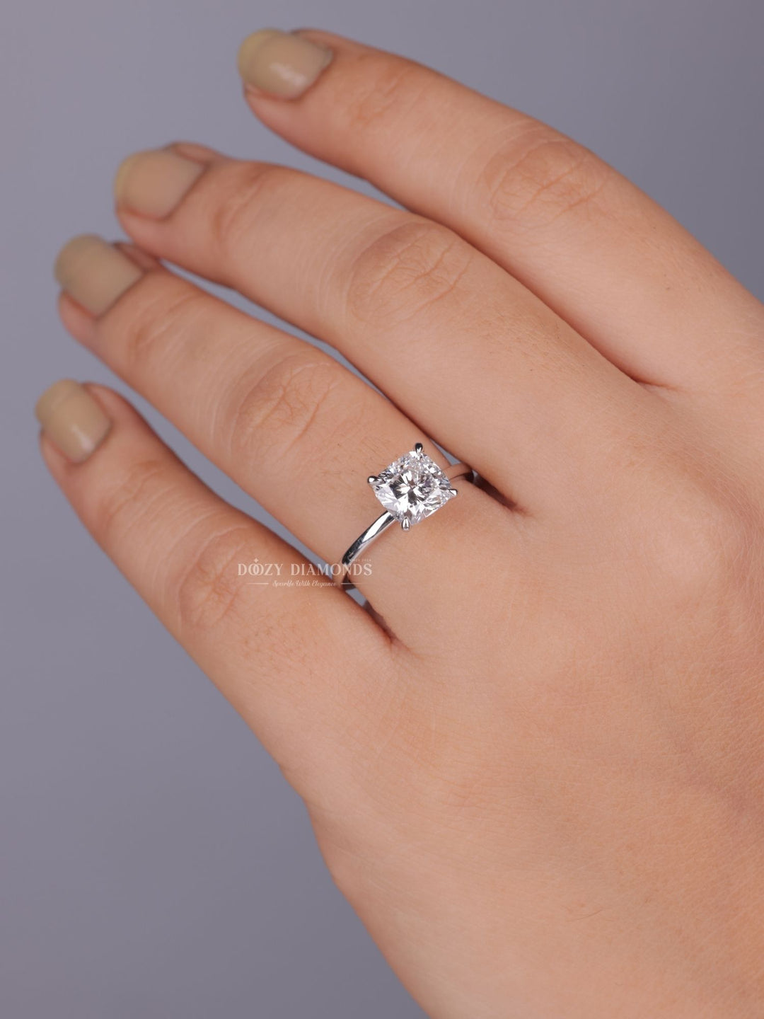 Angled view of cushion cut diamond in solitaire setting