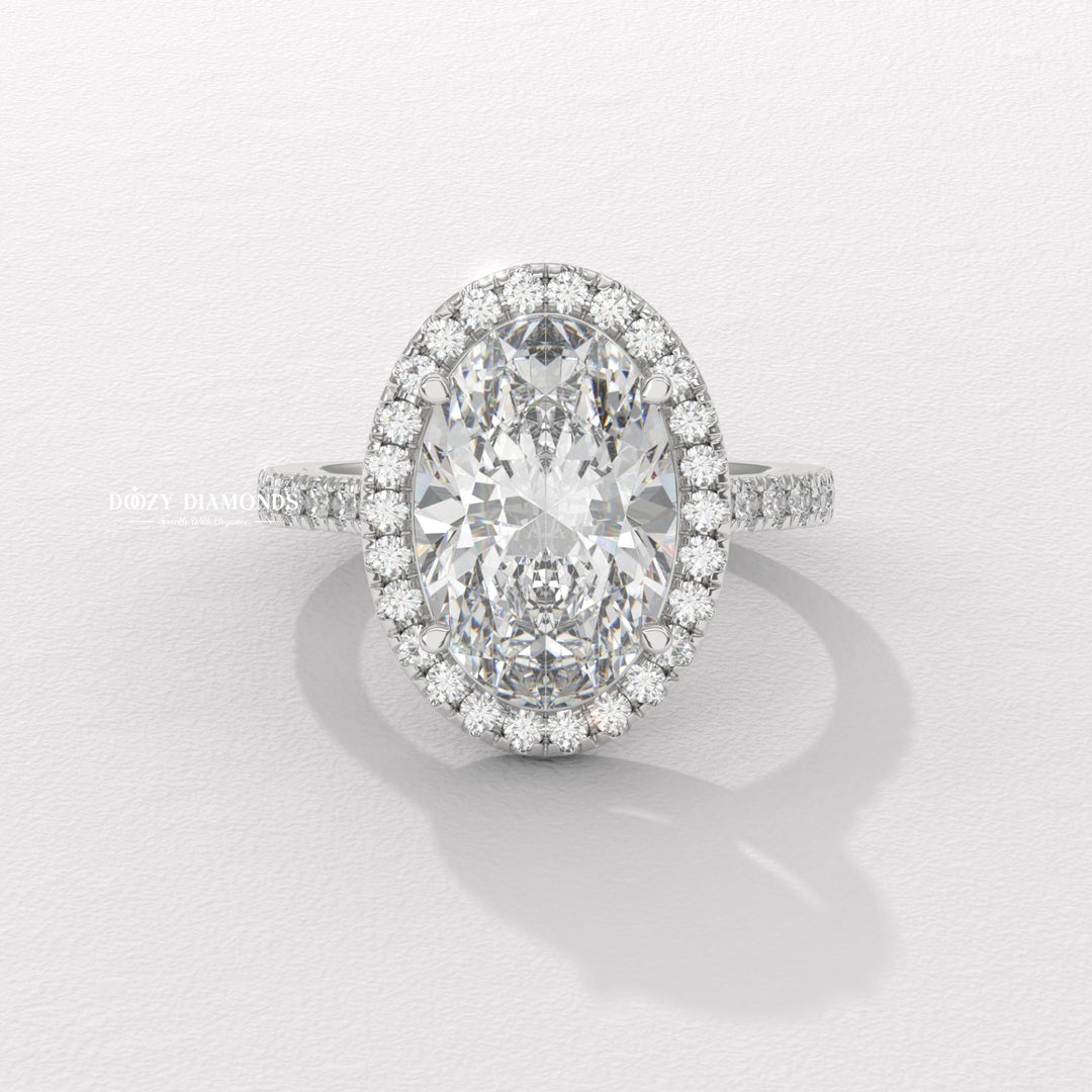 IGI certified oval cut diamond in halo engagement ring setting