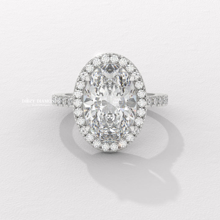 IGI certified oval cut diamond in halo engagement ring setting