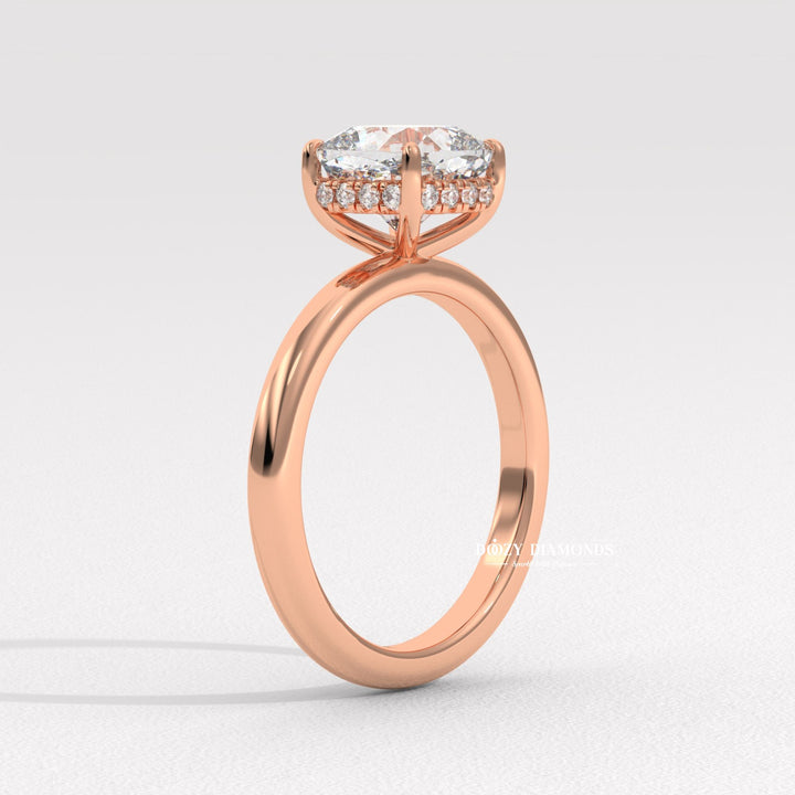 Lifestyle shot of cushion hidden halo diamond ring on hand