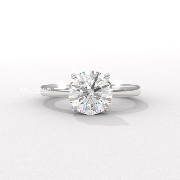 Angled view of round cut diamond in hidden halo setting