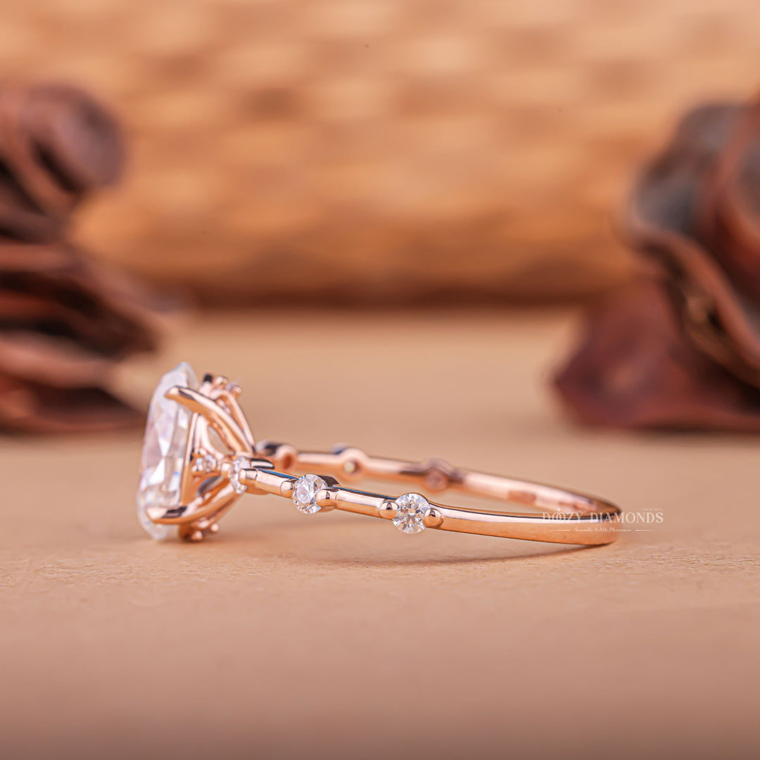 Close-up of oval cut center diamond in pave engagement ring