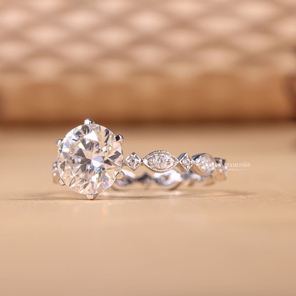 Round pave engagement ring shown on hand for true-to-life sizing
