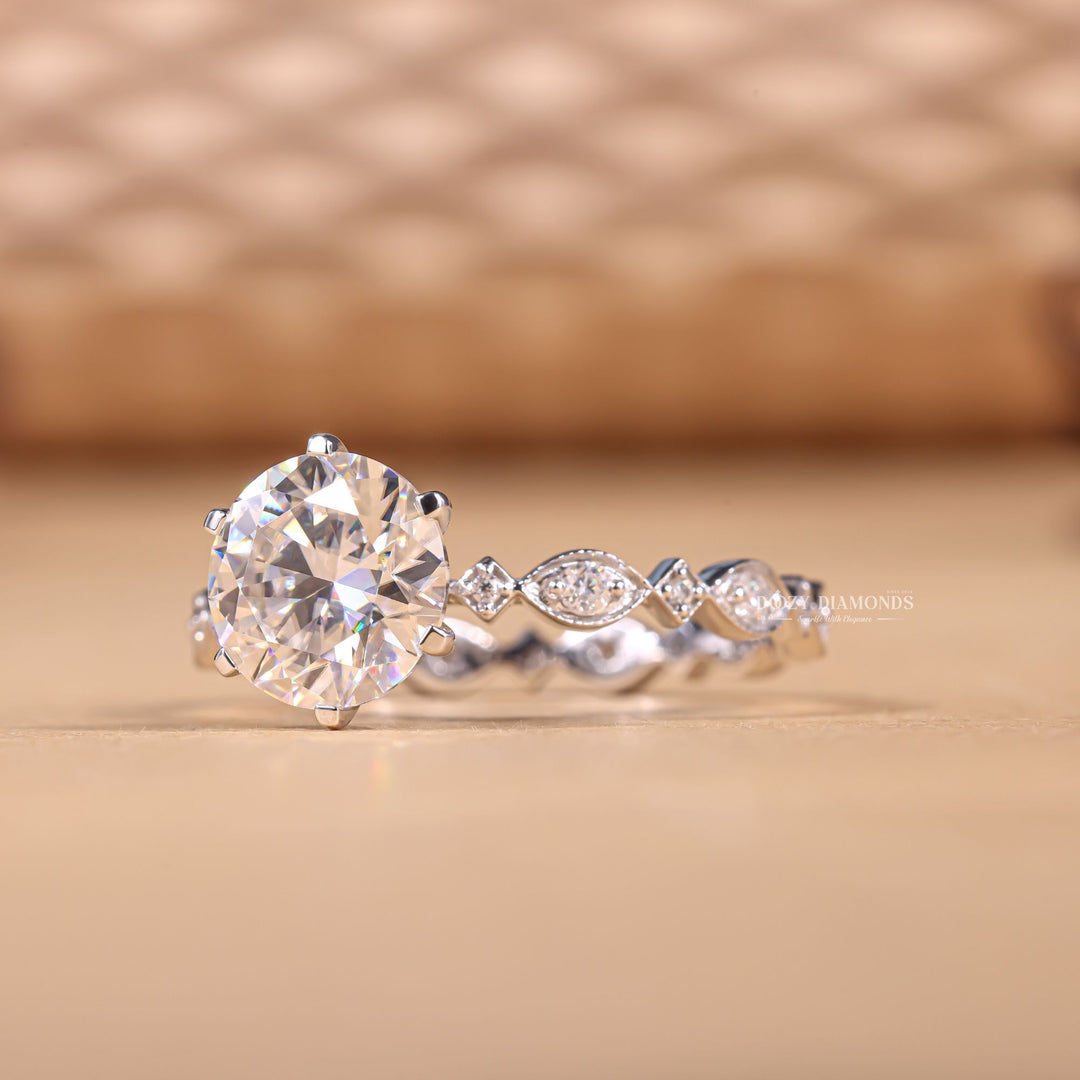 Round pave engagement ring shown on hand for true-to-life sizing