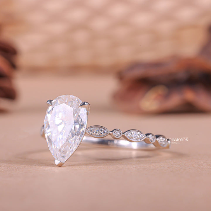 Pear pave diamond ring presented in signature gift packaging