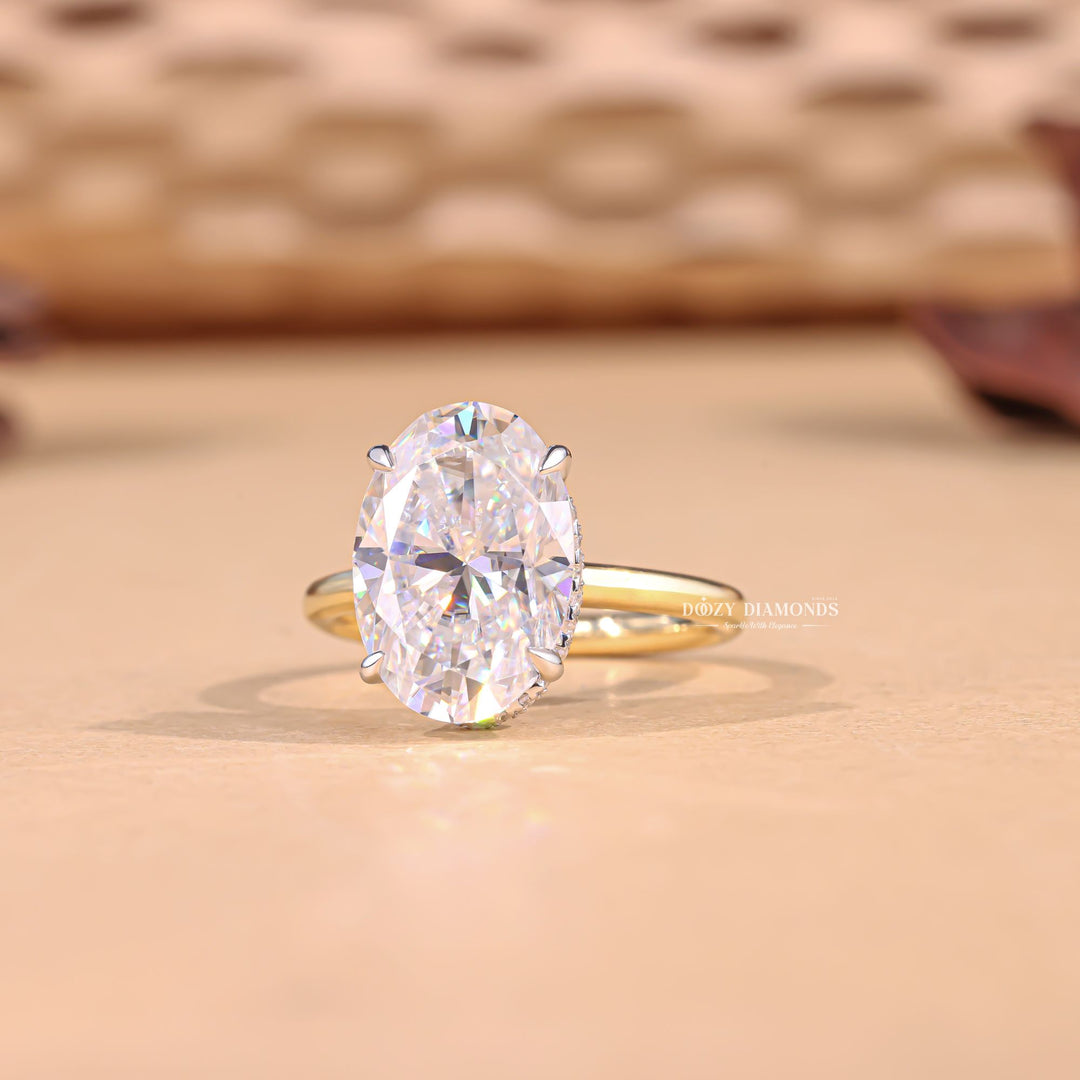 Profile view of oval cut hidden halo engagement ring band