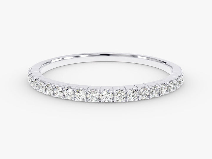 Round diamond band stacked with engagement ring