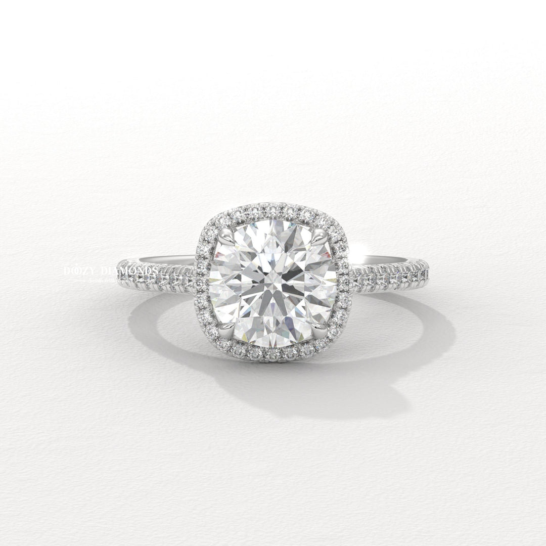 Round halo engagement ring viewed from the side