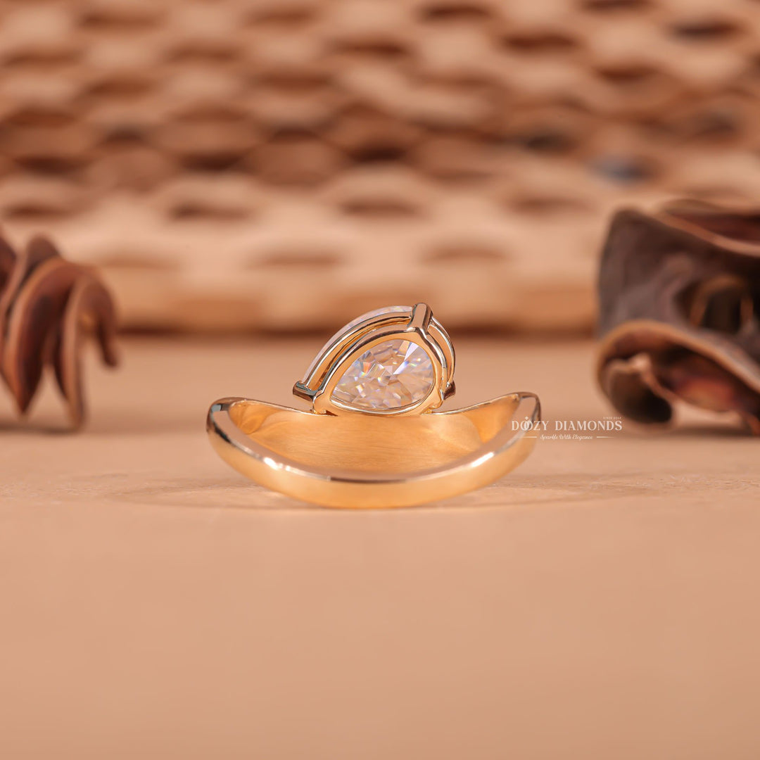 Pear cut dome engagement ring with IGI certified center diamond