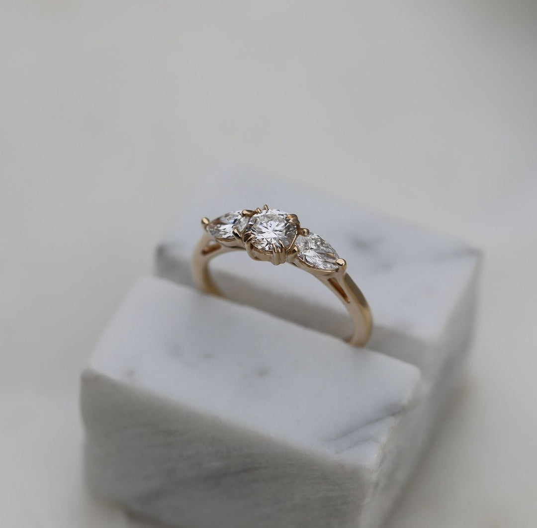 Round solitaire engagement ring viewed from the side